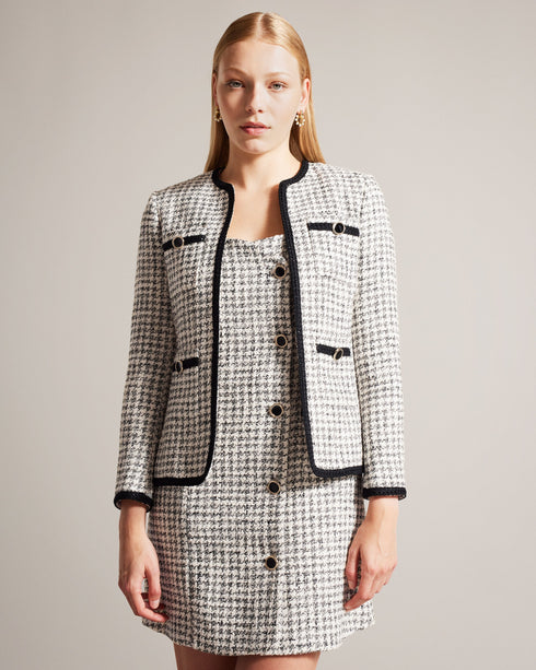 LYRRA-Jackets-Check into the week in style. Featuring a classic dogtooth pattern and contrast trims, LYRRA adds a touch of understated elegance to any outfit. Front pockets and decorative buttons complete the look, with an open front design for easy layering. Boucle jacket Dogtooth pattern Contrast trims Front pockets Decorative buttons Open front- Ted Baker Romania